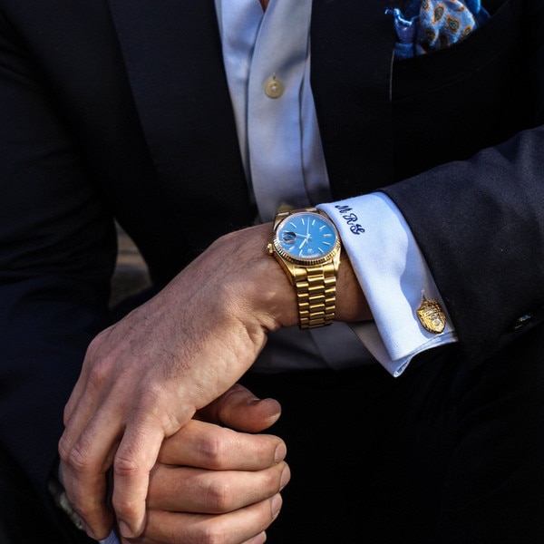 Kyle Cavan Chapel Cuff Links, a man in a suit wearing the gold chapel cufflinks